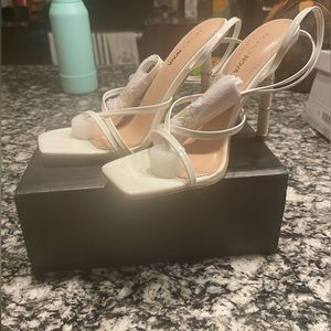 Brand new never worn white and gold fashion nova heels. Shoes are comfortable.